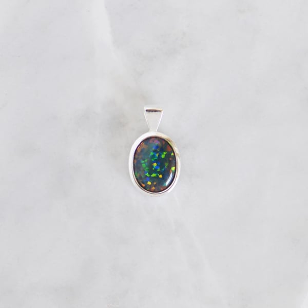 Image of Floral Harlequin Black Opal oval cut silver necklace