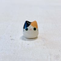 Image 1 of calico cat figurine