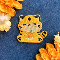 Image 1 of orange tiger patch