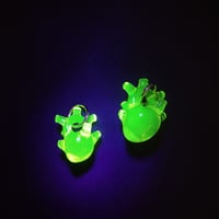 Image 1 of UV Illuminati heart pendants