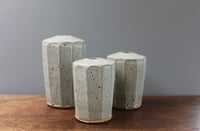 Image 2 of A set of three stem Vases.