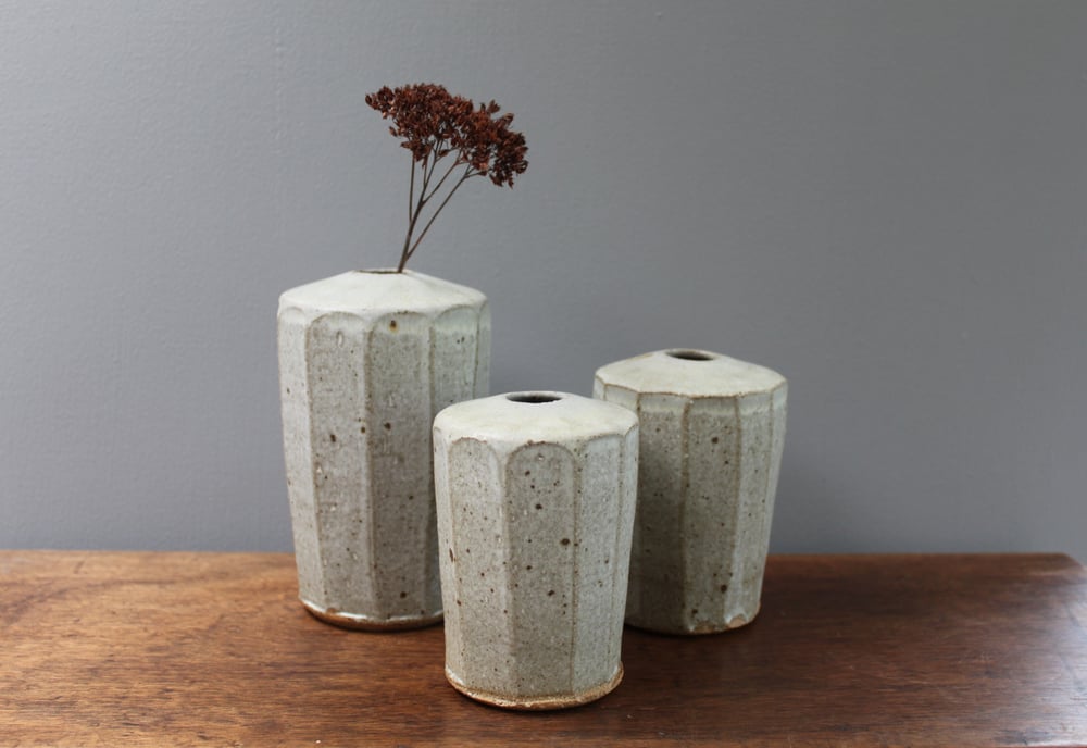 Image of A set of three stem Vases.