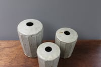 Image 3 of A set of three stem Vases.