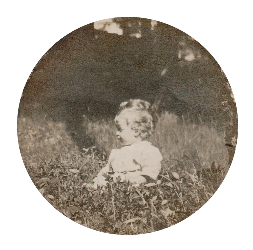 Image of Anonyme: baby sitting in the garden, ca. 1930's