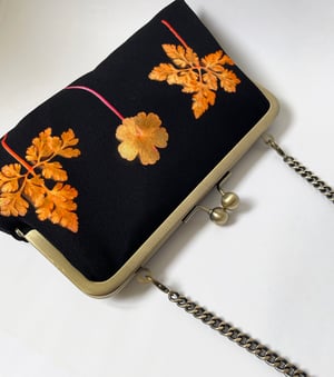 Image of Orange ferns, printed silk clutch bag with chain handle