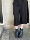 Black cotton pants with ruffled pocket