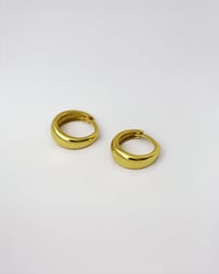 Image 4 of Huggie Hoops in Gold