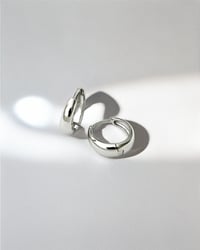 Image 3 of Huggie Hoops in Silver