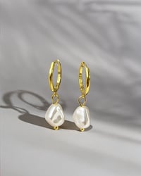 Image 4 of Pearl Drop Huggie Hoops in Gold