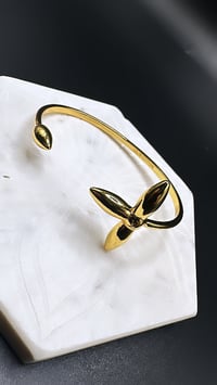 Image 1 of Gold L bangle 