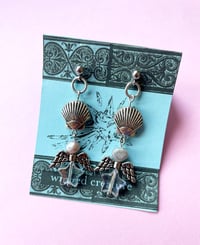 Image of flying star shell earrings