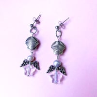 Image of flying star shell earrings