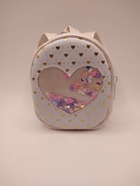 Image 1 of White and gold baby pack
