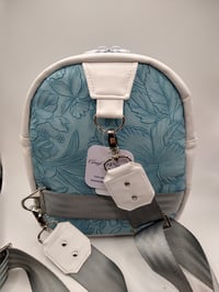 Image 2 of Blue flowers and white sling pack