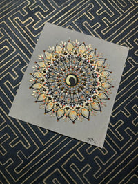 Image 1 of Enzo gold and orange mandala on scrap taupe watercolour paper 