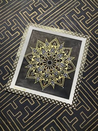 Image 1 of Bronze pigment ink on black background mandala on scrap watercolour paper