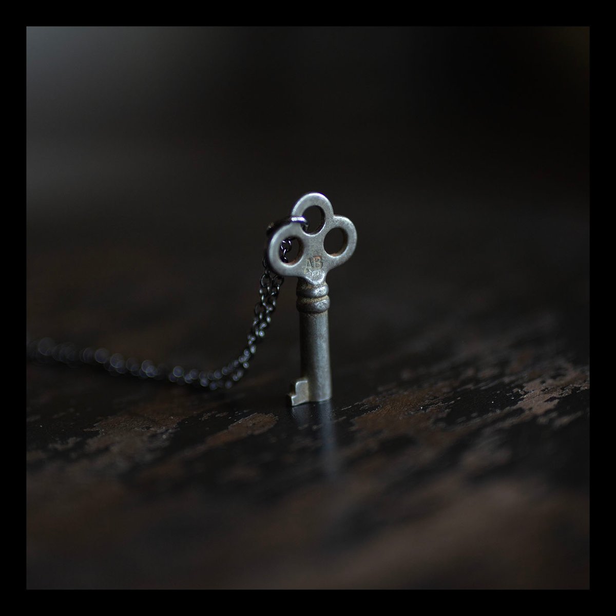 Small silver key necklace with 3 holes