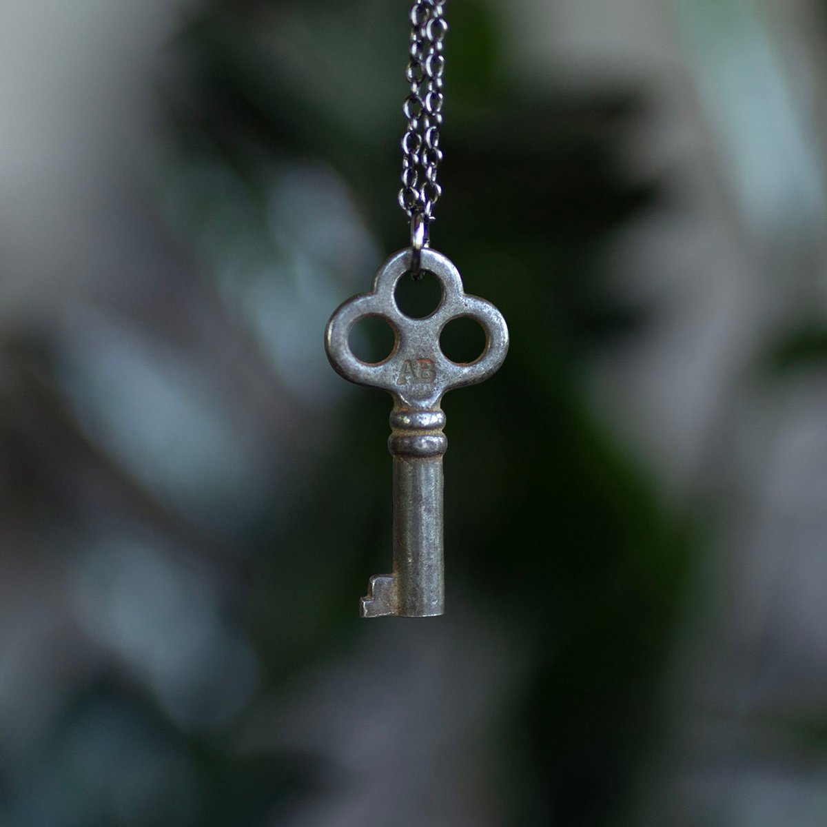 Small silver key necklace with 3 holes