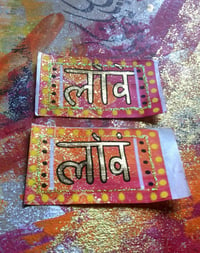 Image 2 of Sanskrit 'Prem' gold chrome paper stickers