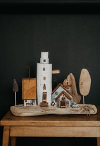 Image 1 of Driftwood houses of the series “Molde Town”