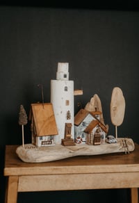 Image 2 of Driftwood houses of the series “Molde Town”