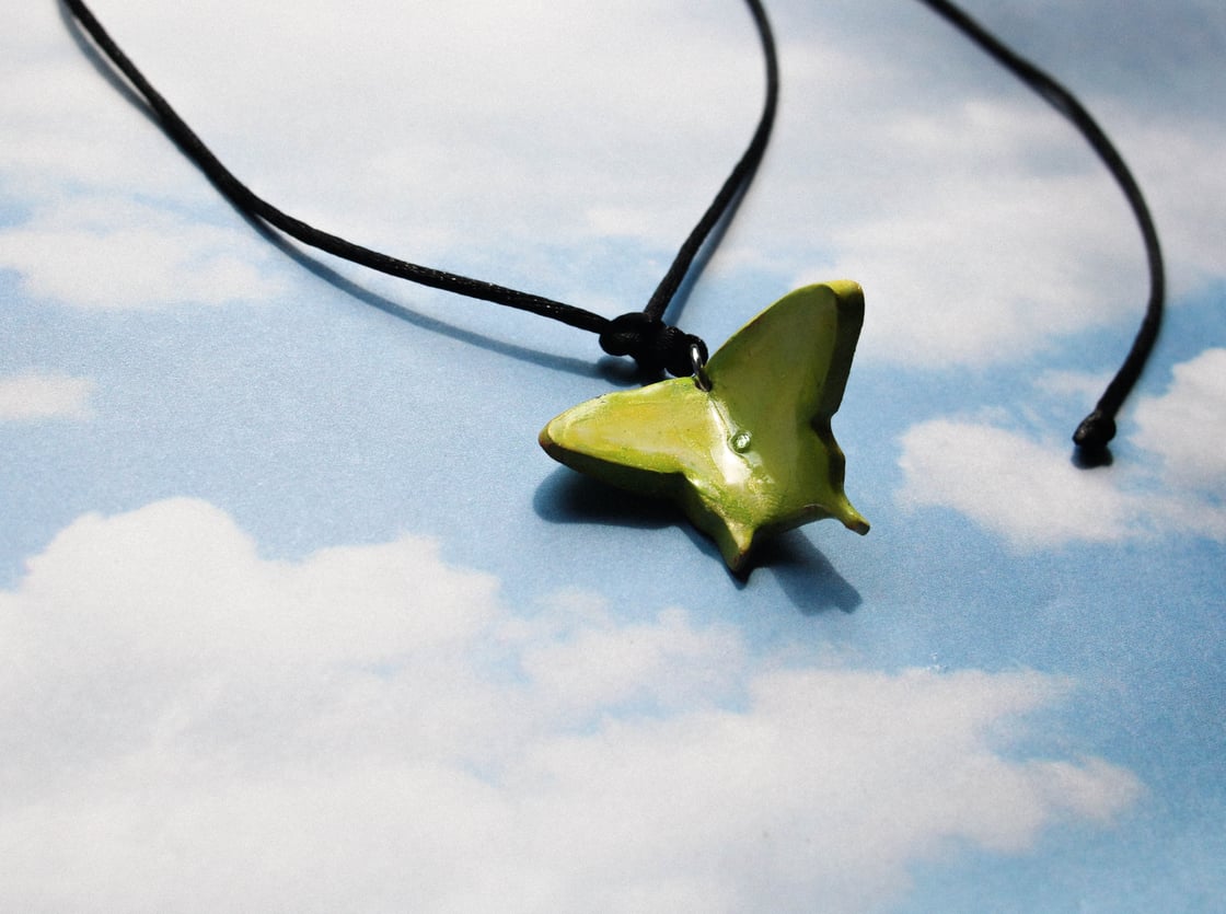 Image of green moth talisman