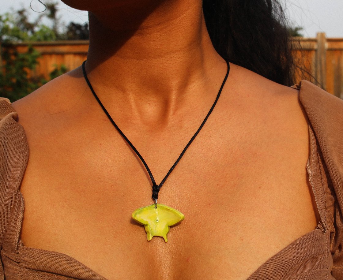 Image of green moth talisman