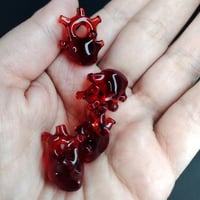 Image 2 of Ruby red miniature anatomical heart pendant