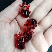 Image 1 of Ruby red miniature anatomical heart pendant