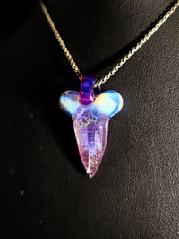 Image 1 of Karmaline/moonstone dichroic shark tooth pendant with a royal jelly bale.