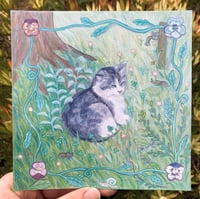 Image 1 of sleepy tabby in garden - square print