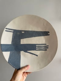 Large hand and deer plate