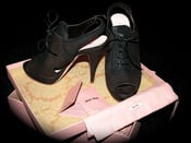 Image of MIU MIU dark brown leather cut-out lace-up pumps