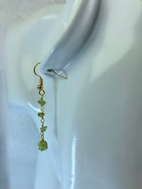 Image 2 of Verdant Whisper Drops | dainty peridot chips gold dangling earrings