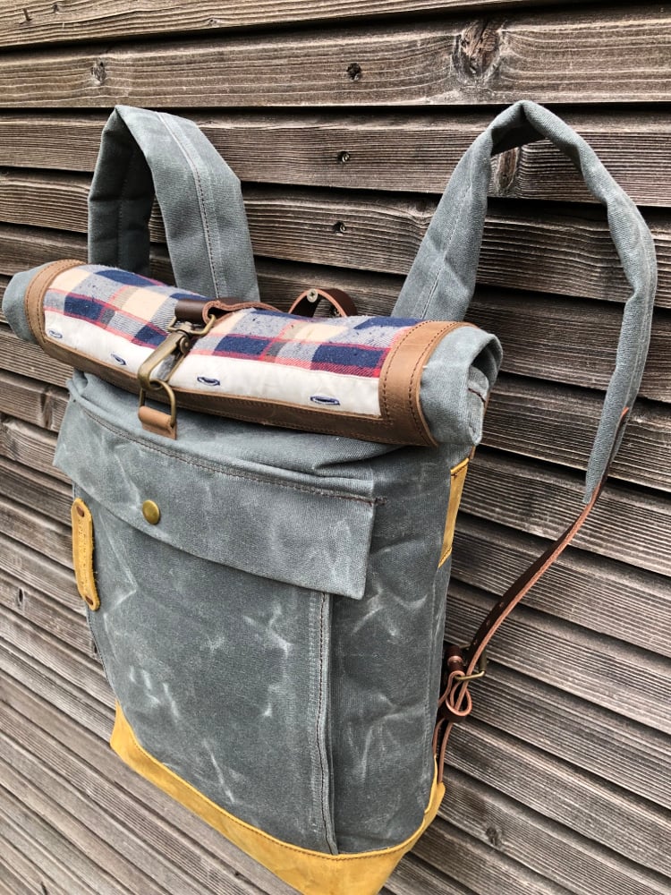 Image of Backpack made with recycled base and roll to close top