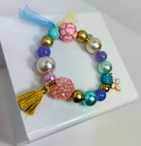 Image 2 of Blue Crown & Gold Tassel Charm Elastic Bracelet 