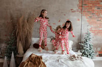 Image 1 of JSP Studio Holiday Petite | Pajamas & Glitter Snow in the studio bedroom + the studio swing