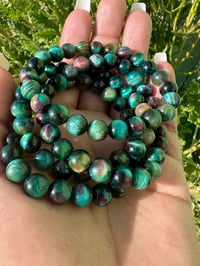 Image 1 of Peacock  Tiger Eye