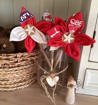 Image 1 of Memory Flowers custom created from a clients loved ones precious sports clothing
