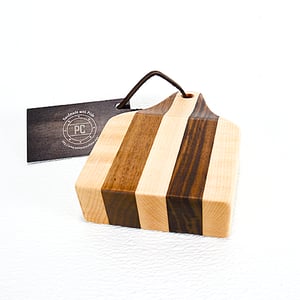 Image of Due Salt and Pepper Shaker holder and mini Walnut and Maple Cutting Board on the flip side