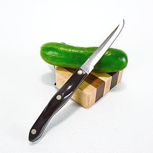 Image of Due Salt and Pepper Shaker holder and mini Walnut and Maple Cutting Board on the flip side