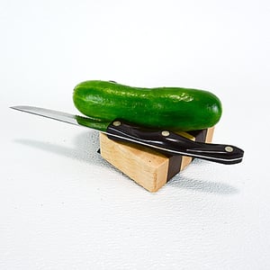 Image of Due Salt and Pepper Shaker holder and mini Walnut and Maple Cutting Board on the flip side
