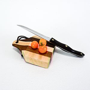 Image of Due Salt and Pepper Shaker holder and mini Walnut and Maple Cutting Board on the flip side