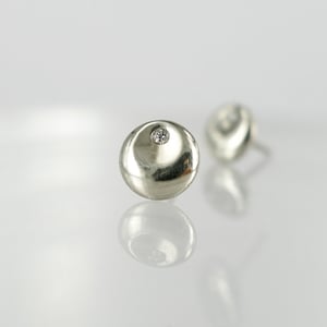 Image of 9ct white gold diamond set stud earrings. pj5513