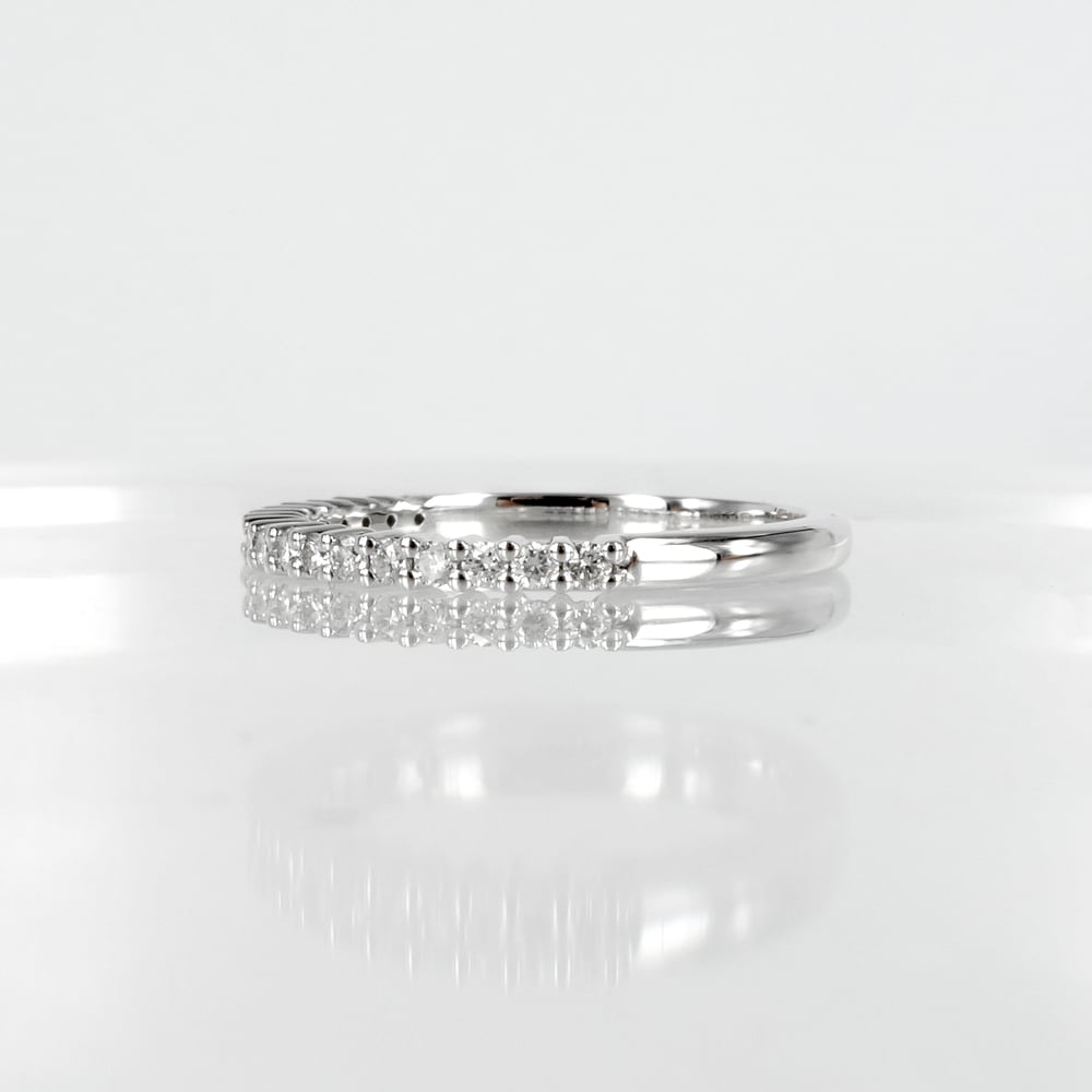 Image of 18ct white gold shared claw diamond set wedding / eternity ring. NC1