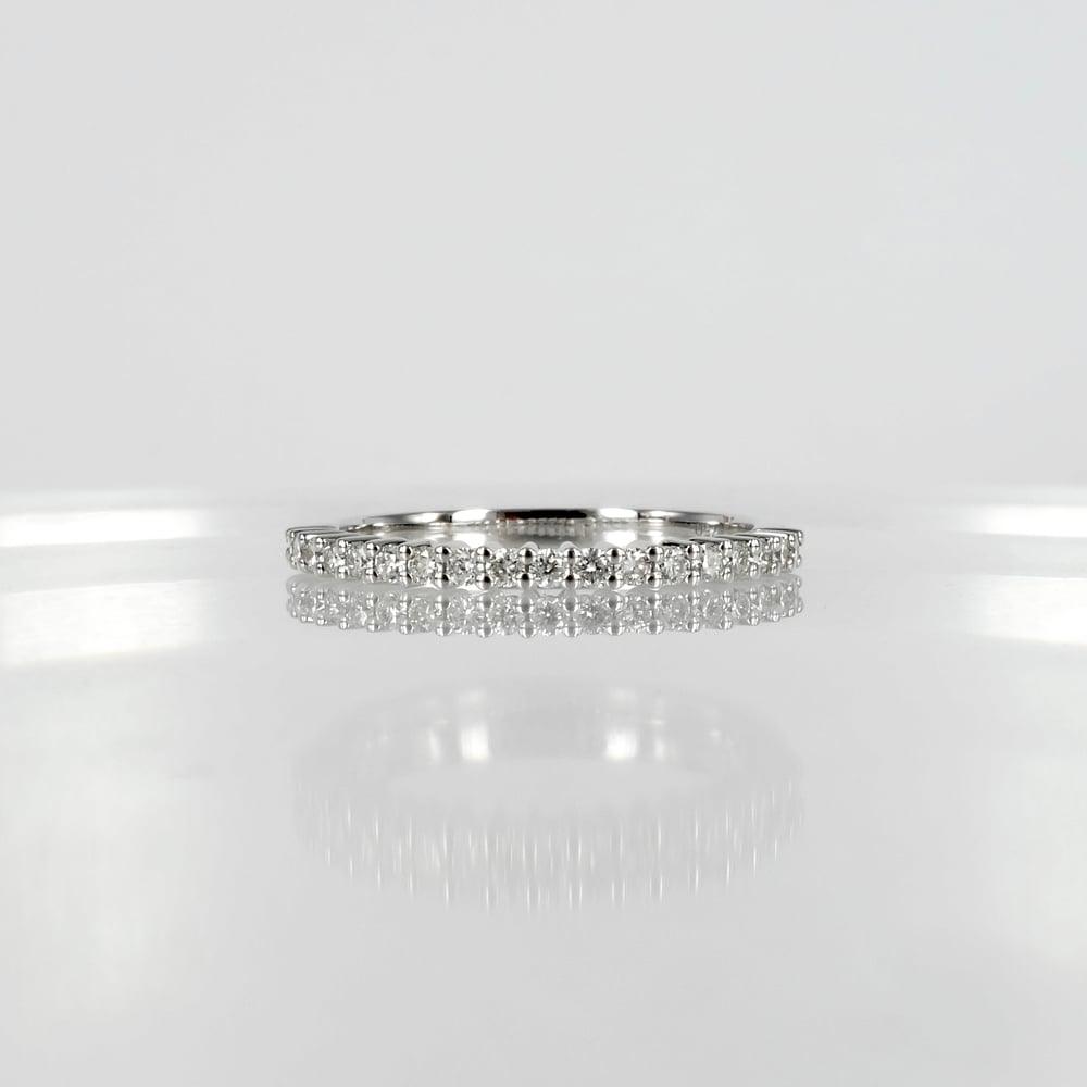 Image of 18ct white gold shared claw diamond set wedding / eternity ring. NC1