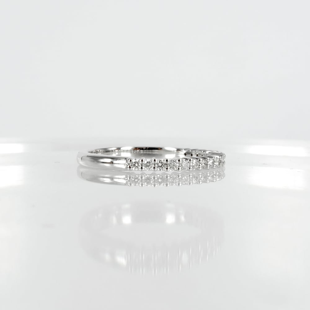 Image of 18ct white gold shared claw diamond set wedding / eternity ring. NC1