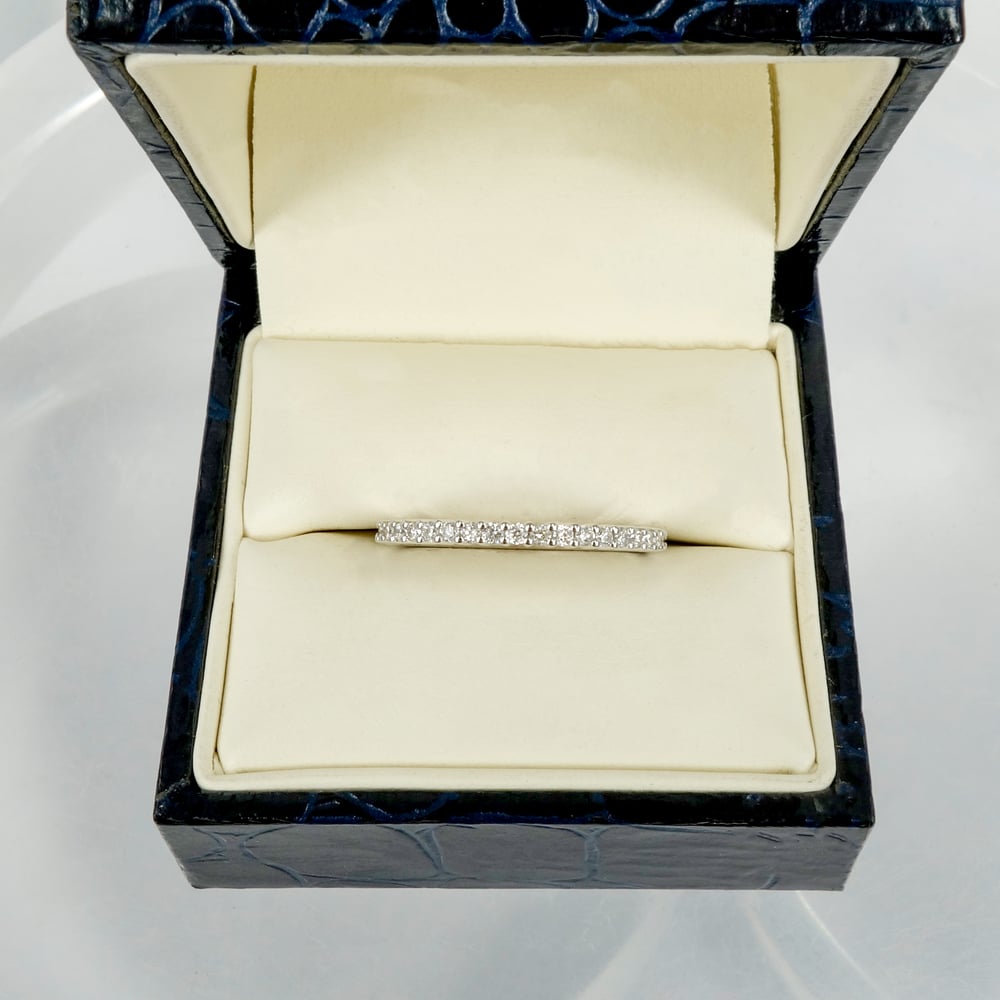 Image of 18ct white gold shared claw diamond set wedding / eternity ring. NC1