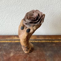 Image 3 of a handheld rose