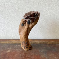 Image 1 of a handheld rose